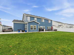 Back of property with a patio and a fenced backyard