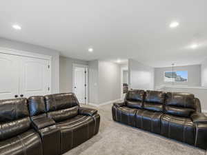 Living area featuring carpet and recessed lighting