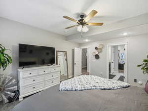 Bedroom with a ceiling fan and baseboards