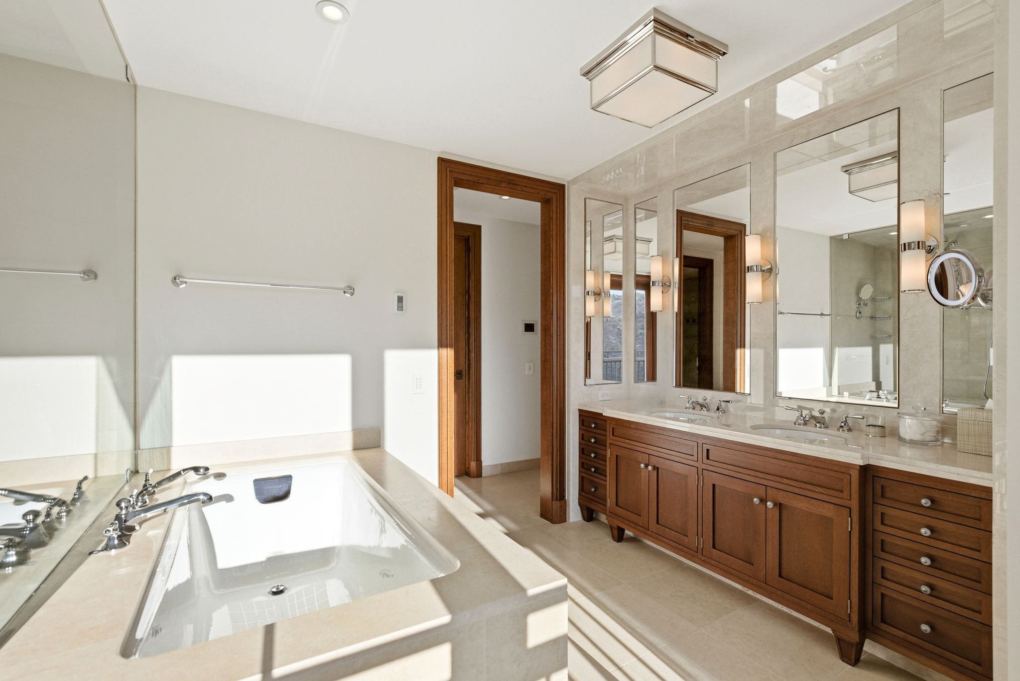Full bath with double vanity and a garden tub
