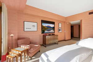 Bedroom with baseboards and carpet flooring