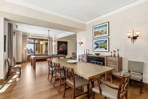 Dining area with pool table and wood finished floors