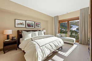 Bedroom featuring carpet flooring and access to outside