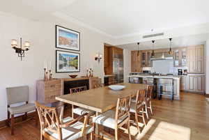 Dining room featuring light wood-type flooring and wine cooler