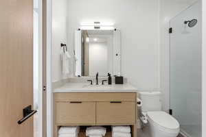 Bathroom with vanity and a stall shower