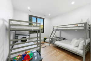 Bedroom with light wood-style floors