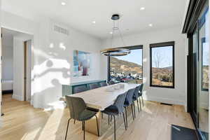 Dining room featuring recessed lighting and light wood-style flooring