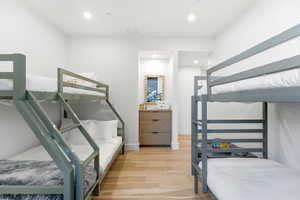 Bedroom with light wood-type flooring and recessed lighting
