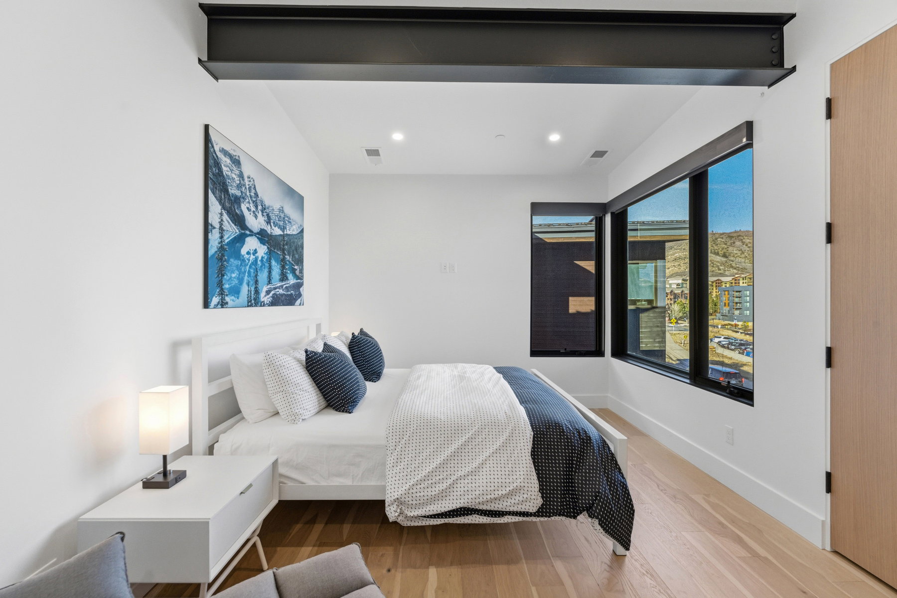 Bedroom with wood finished floors and recessed lighting
