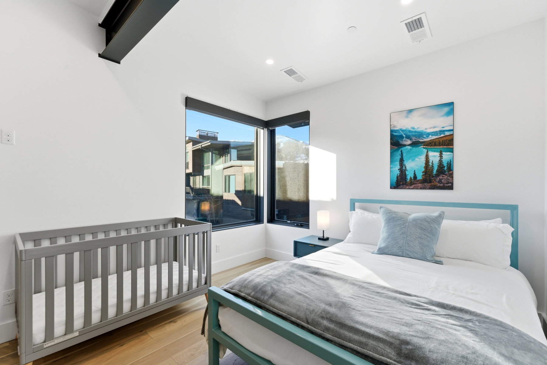 Bedroom featuring light wood-style flooring and baseboards