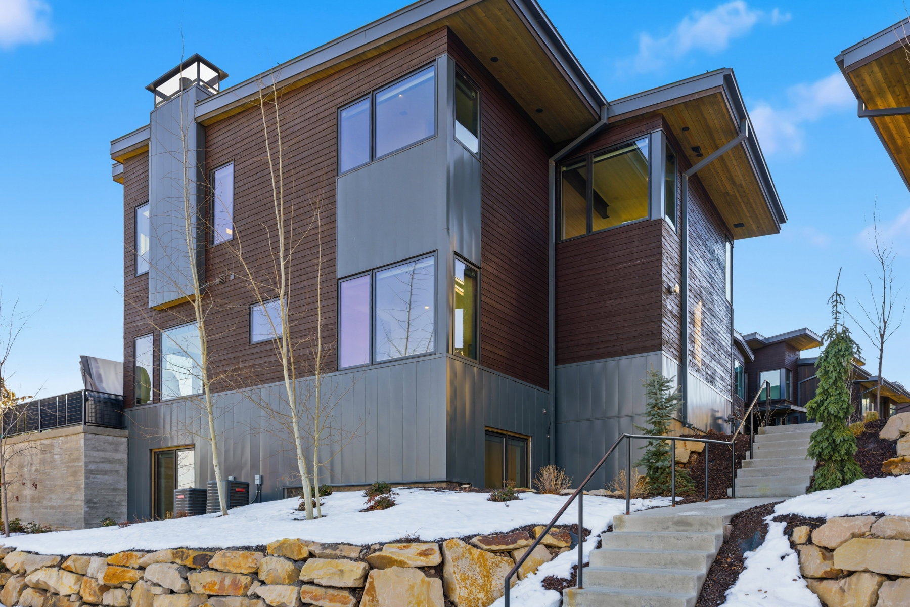 View of snow covered exterior featuring stairs