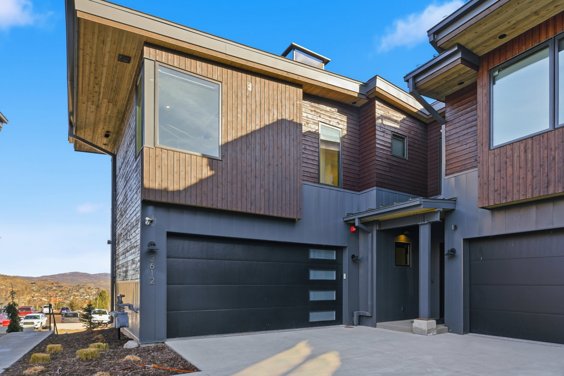 Modern home featuring a garage and driveway