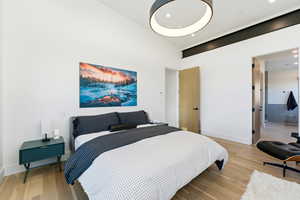 Bedroom featuring light wood-style flooring and baseboards