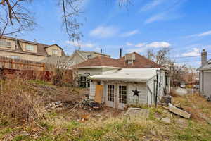 Back of house featuring french doors