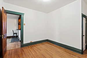 Spare room with wood finished floors and baseboards
