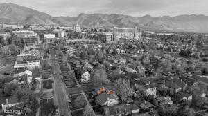 Aerial view of property's location in color featuring Eccles stadium and mountainous background