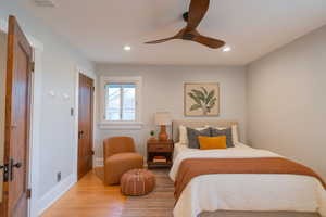 Bedroom featuring wood finished floors, a ceiling fan, and recessed lighting