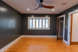 Unfurnished bedroom featuring light wood-style flooring, a ceiling fan, and recessed lighting