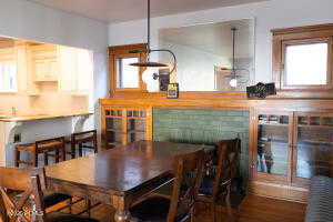 Dining area featuring wood finished floors. Fireplace.