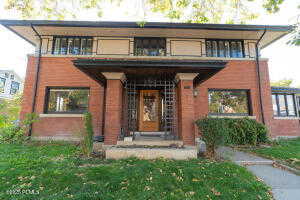 View of front of property featuring a front yard and a porch