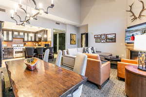 Great Room with ski resort views, vaulted ceilings, fireplace, and private balcony.