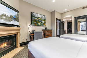 Suite with 2 queens, ski resort views, fireplace, kitchenette, and bathroom