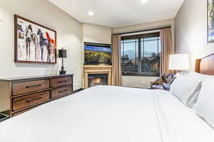 Primary suite with king bed, ski resort views and fireplace.
