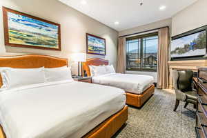 Suite with 2 queens, ski resort views, fireplace, kitchenette, and bathroom