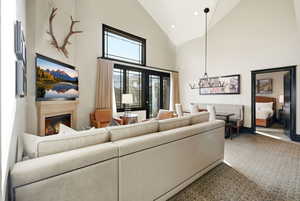 Great Room with ski resort views, vaulted ceilings, fireplace, and private balcony.