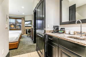 Suite with 2 queens, ski resort views, fireplace, kitchenette, and bathroom