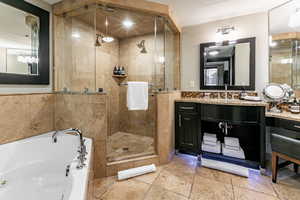 Primary bathroom with jetted tub and double vanity
