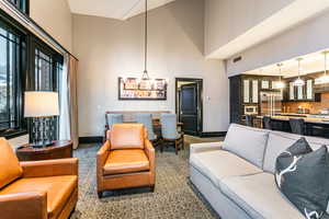 Great Room with ski resort views, vaulted ceilings, fireplace, and private balcony.