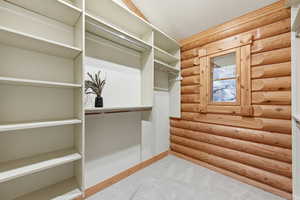 Spacious closet with carpet floors