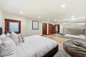 Bedroom featuring light wood finished floors and recessed lighting