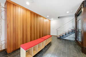 Lobby with recessed lighting and wood walls