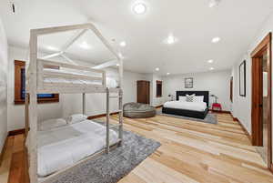 Bedroom featuring light wood-style flooring and recessed lighting
