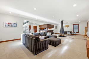 Living area featuring recessed lighting and stairway