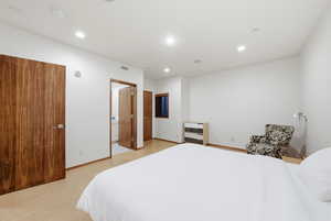 Bedroom with recessed lighting and baseboards