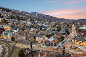 Aerial view at dusk of a mountain view and a residential view
