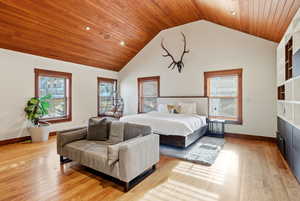 Bedroom with wood ceiling, multiple windows, light wood-style flooring, high vaulted ceiling, and recessed lighting