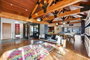 Living room featuring wooden ceiling and hardwood / wood-style flooring