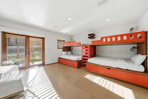 Bedroom with recessed lighting, access to outside, light flooring, and french doors