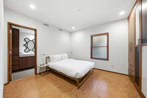 Bedroom featuring light flooring and recessed lighting