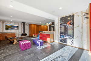 Reception area featuring recessed lighting and a wood stove