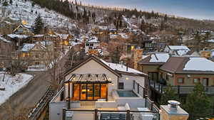 Snowy aerial view featuring a residential view