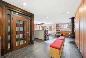 Community lobby featuring recessed lighting and wallpapered walls