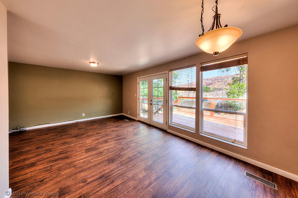 Dining/living area with walkout to upper deck.