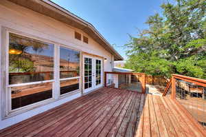 Wooden deck with french doors.