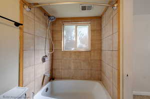 Bathroom featuring shower / bathtub combination