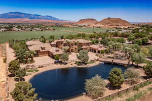 Aerial view of sparsely populated area with a water and mountain view